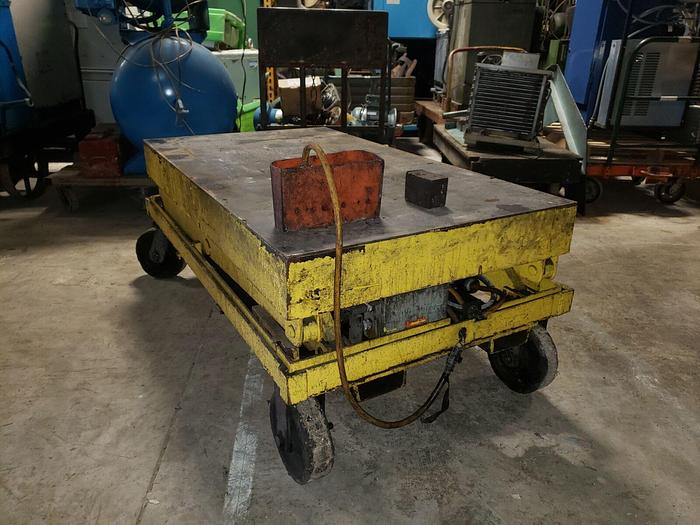 Used Large Yellow 6000# Scissor Lift on 4 Castors, 64” x 36” Platform