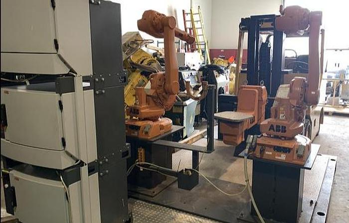 Used ABB IRB 1600-5/1.45 DUAL ARM ROBOTIC CELL WITH ABB TYPE MTC 750 POSITIONER AND IRC5 CONTROLLERS