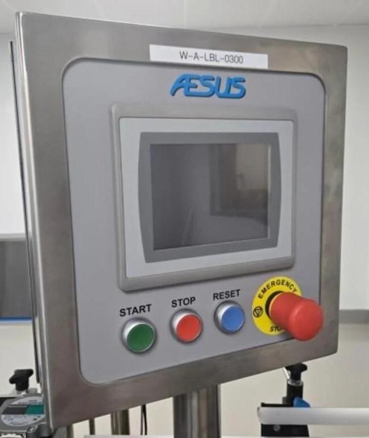 Used Used Aesus Automatic Stainless Steel Panel and Wrap Pressure Sensitive Labeler, Model Eco-Panel