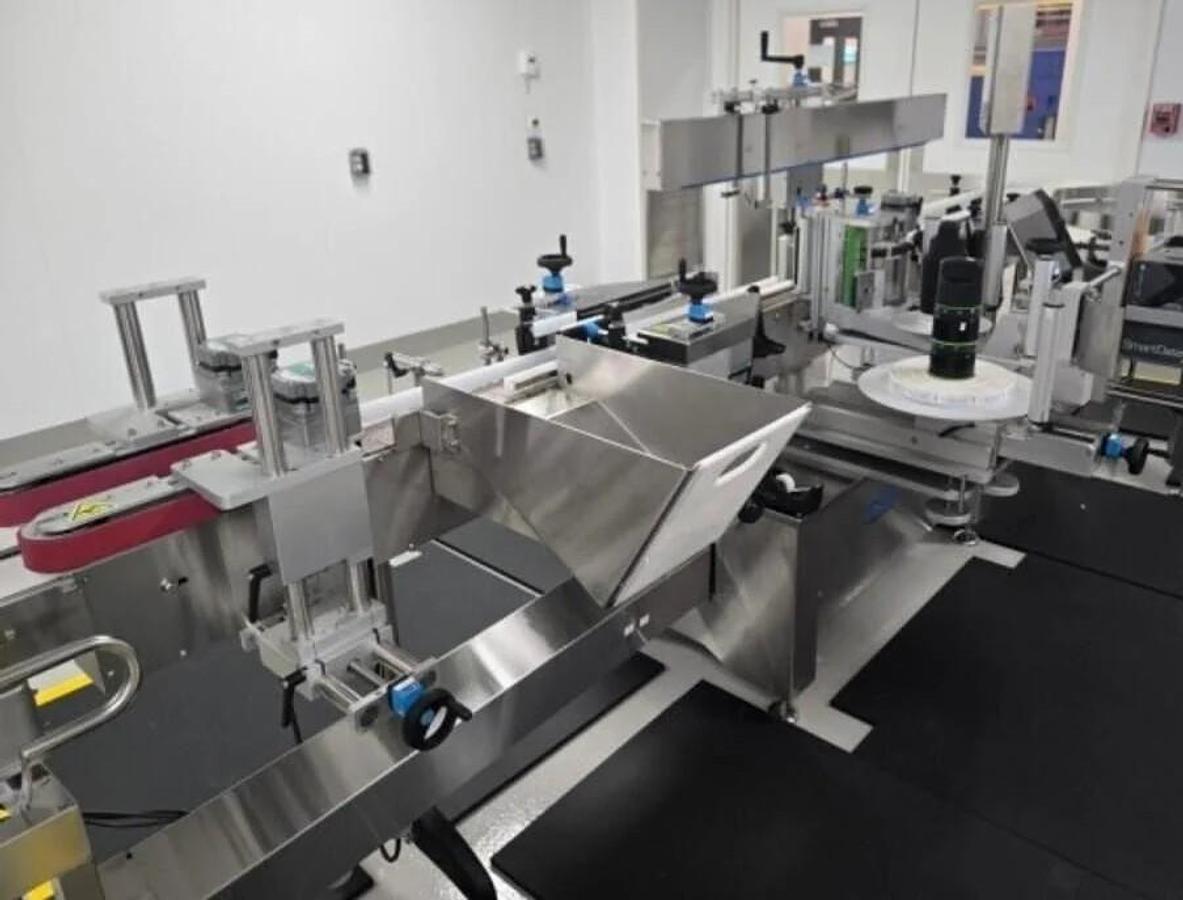 Used Used Aesus Automatic Stainless Steel Panel and Wrap Pressure Sensitive Labeler, Model Eco-Panel