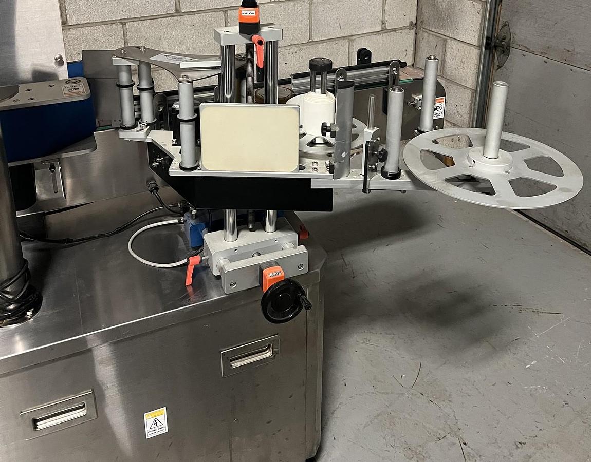 Used Used HealthCaps Automatic Pressure Sensitive Wraparound Labeler