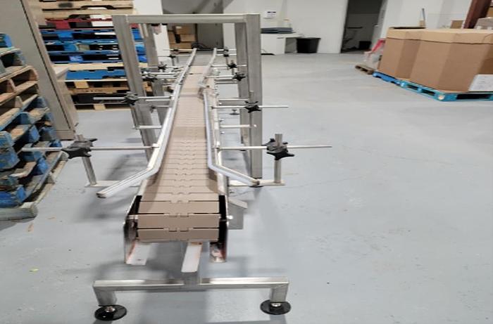 Used Used ActionPac 12’ Long x 6” Wide Stainless Steel Motorized Conveyor 