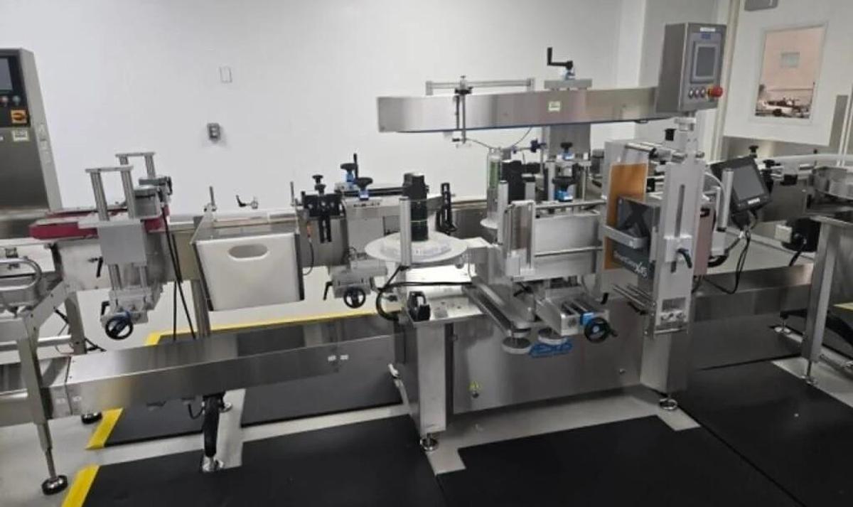 Used Used Aesus Automatic Stainless Steel Panel and Wrap Pressure Sensitive Labeler, Model Eco-Panel