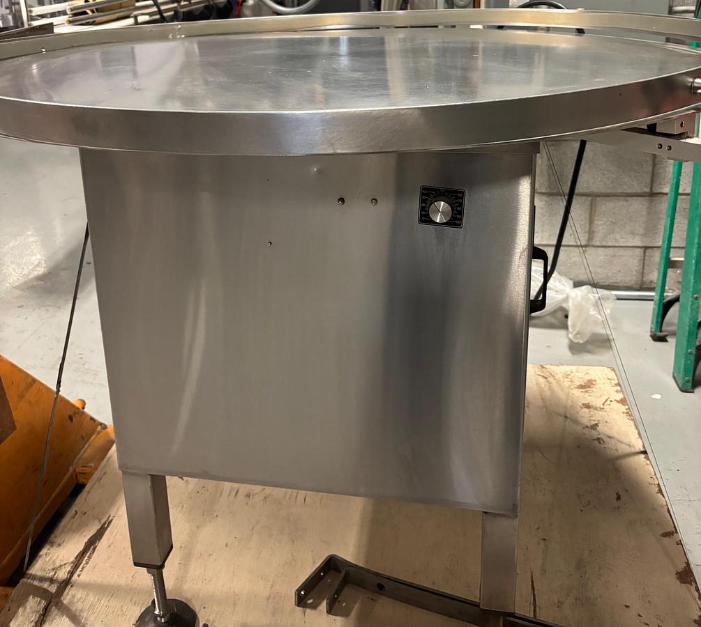 Used Used Capmatic 48” Stainless Steel Accumulating Table