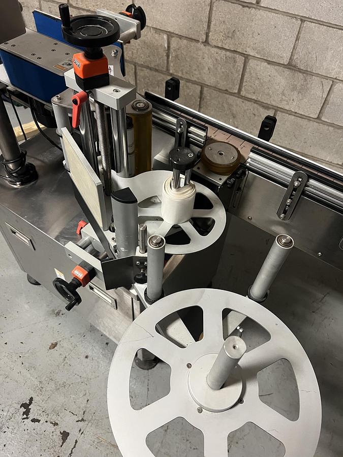 Used Used HealthCaps Automatic Pressure Sensitive Wraparound Labeler