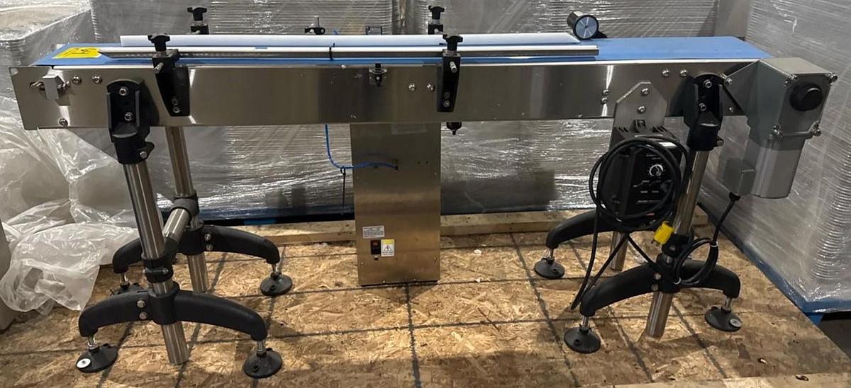 Used Used Stainless Steel 71” long x 8-1/2” wide motorized conveyor