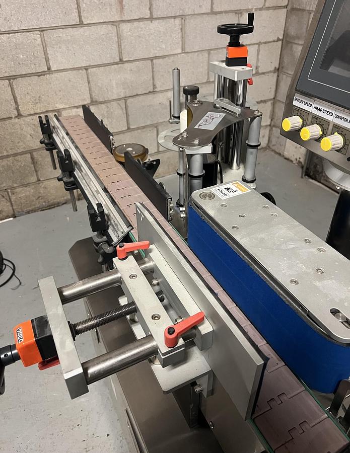 Used Used HealthCaps Automatic Pressure Sensitive Wraparound Labeler