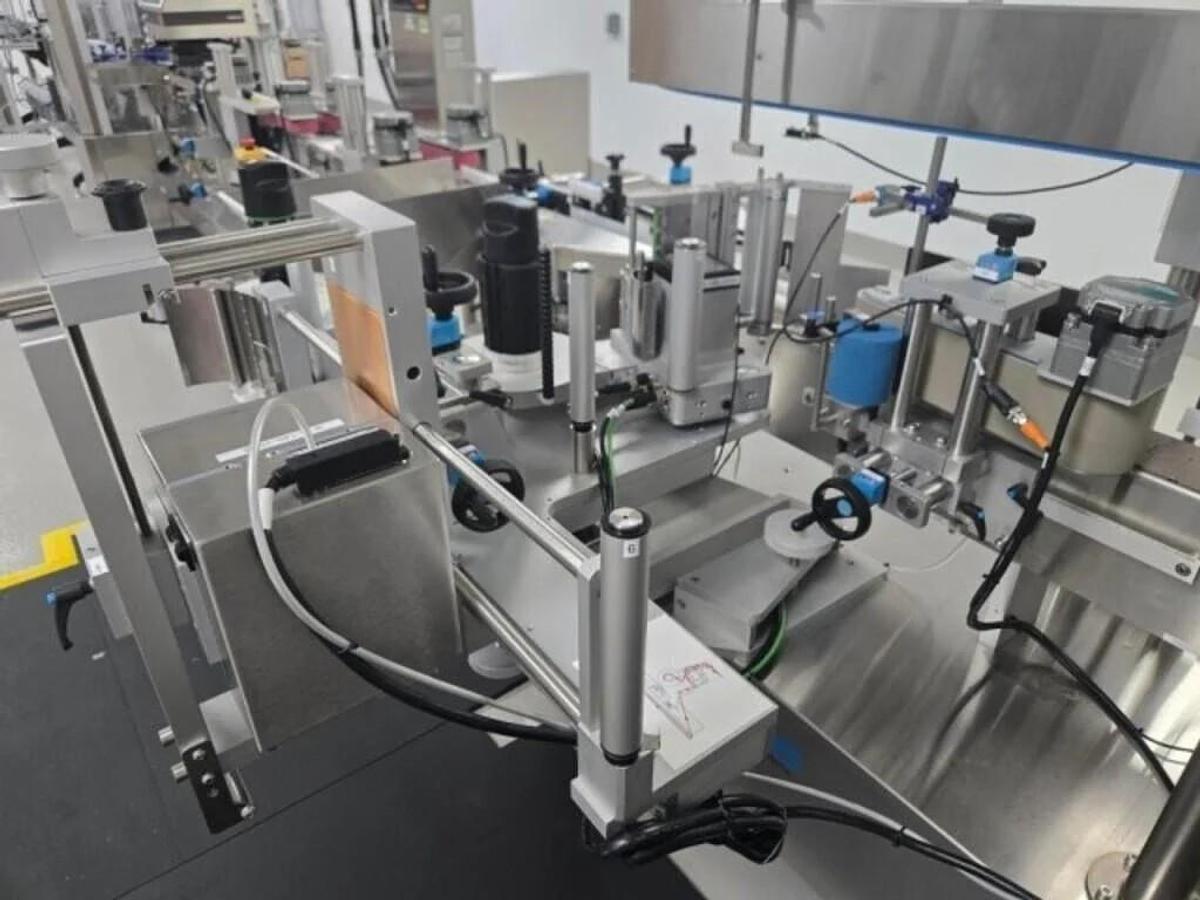 Used Used Aesus Automatic Stainless Steel Panel and Wrap Pressure Sensitive Labeler, Model Eco-Panel