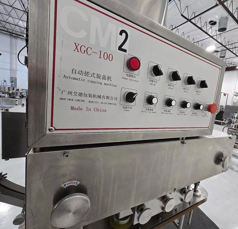 Used Used Automatic Inline Quill Capper, Model XGC – 100