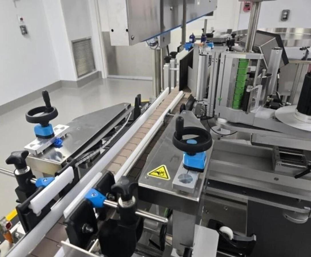 Used Used Aesus Automatic Stainless Steel Panel and Wrap Pressure Sensitive Labeler, Model Eco-Panel