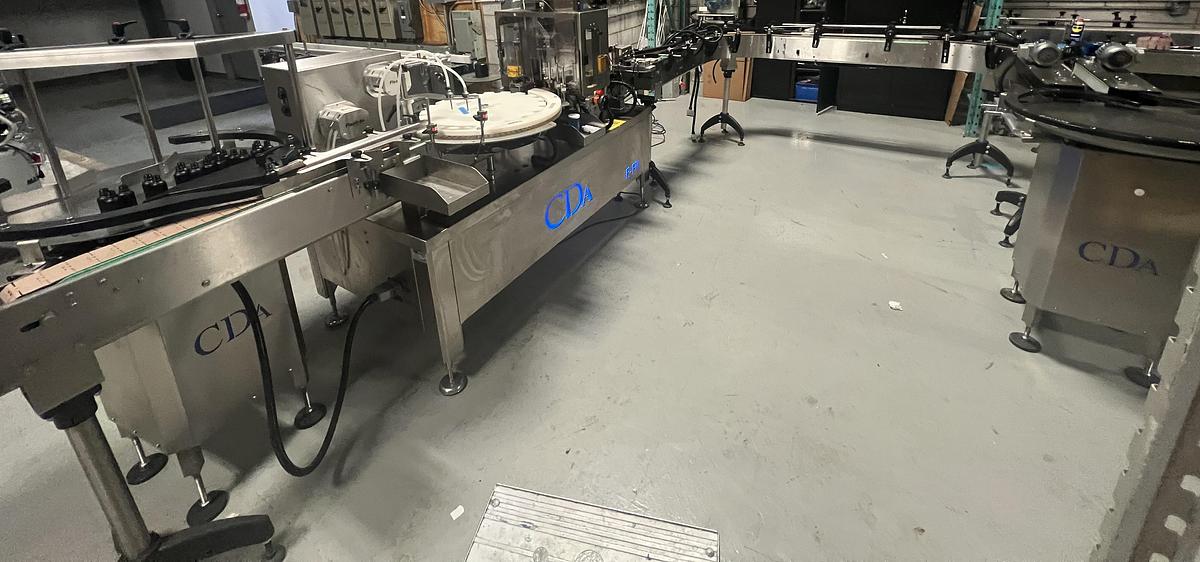 Used Used CDA E-FILL Automatic Monobloc Liquid Filling and Packaging Line, Model E-FILL