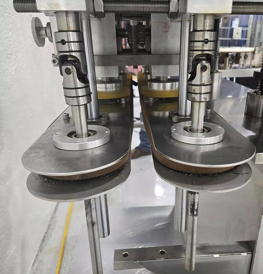 Used Used Automatic Inline Quill Capper, Model XGC – 100