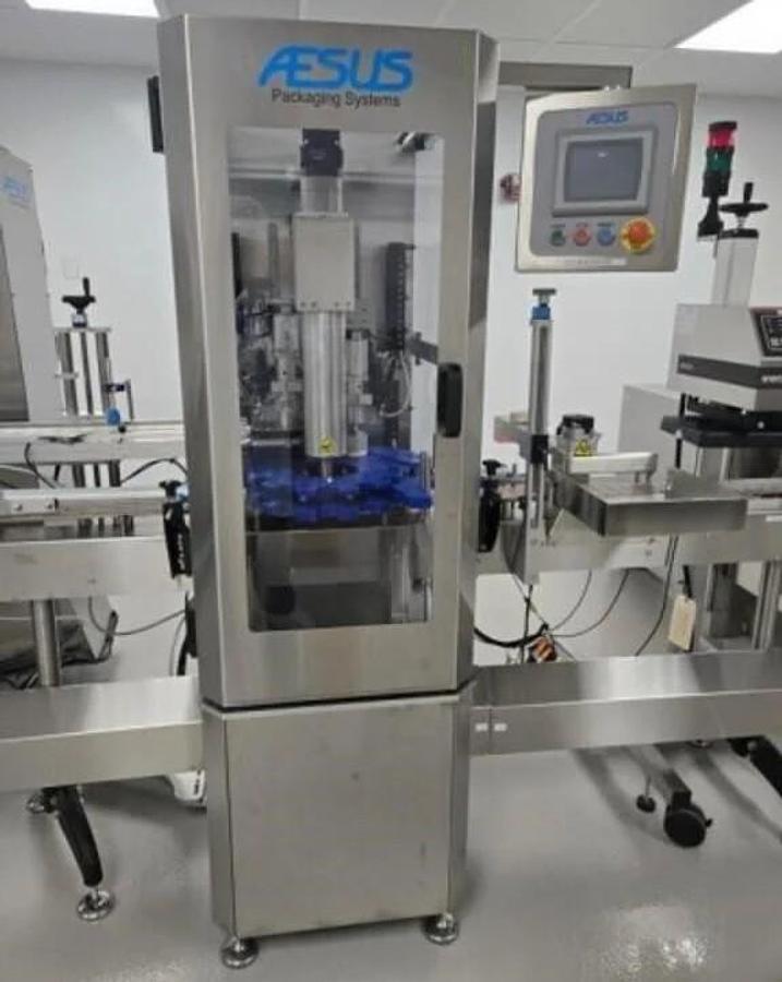 Used Used Aesus Automatic Stainless Steel Push Through (Chuck) 2 Station Capper, Model ECO-STARCAP