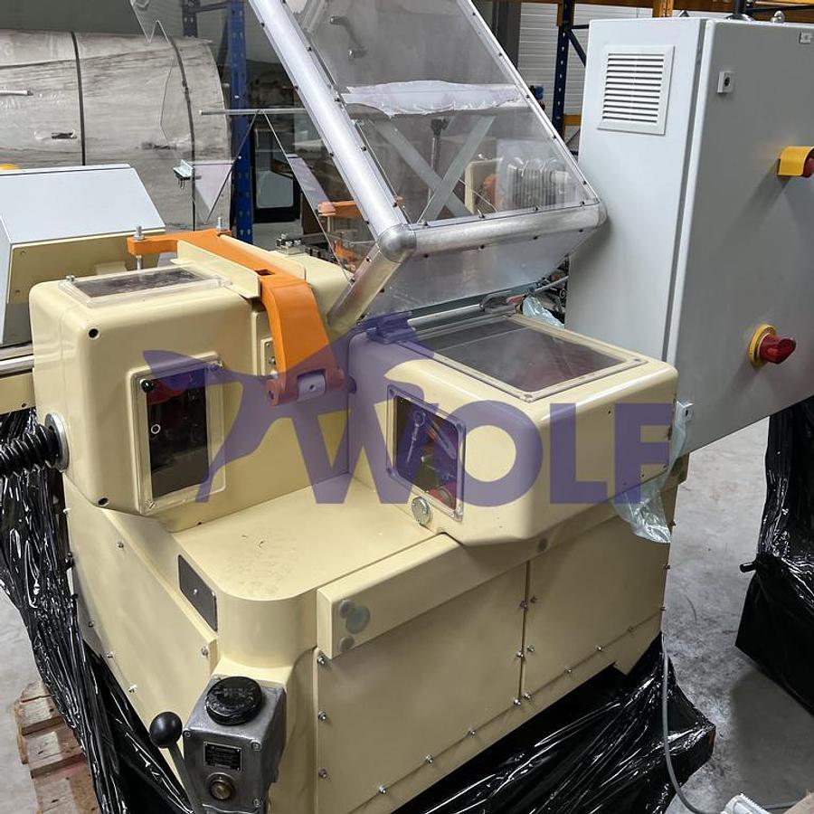 Gebraucht Stannioliermaschine RASCH - Type RK, mit Eintaktband für Flachboden-Artikel.