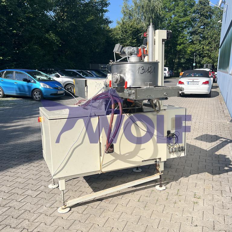 Used Dosing and depositing machine CHOCOMA - Type F-409 for nougat masses, year of manufacture 1999.