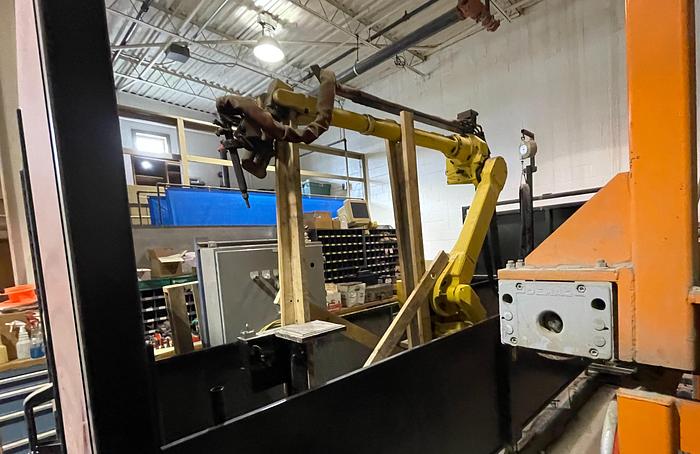 Used LINCOLN SYSTEM 55 WITH FANUC M710iC/20L TORCH CUTTING CELL WITH DUAL ROLL IN ROLL OUT TABLES