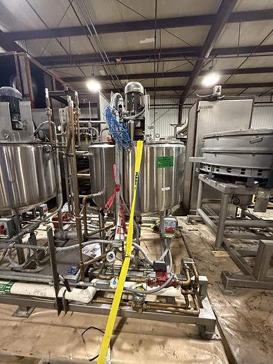 Used DUAL AB PROCESS TANKS WITH HEATERS AND PUMP