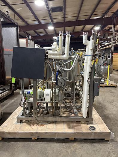 Used DUAL AB PROCESS TANKS WITH HEATERS AND PUMP