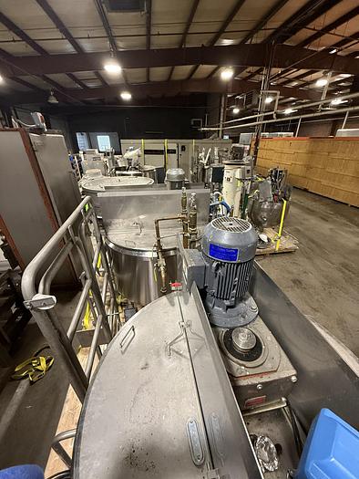 Used DUAL AB PROCESS TANKS WITH HEATERS AND PUMP