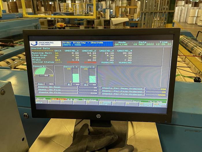 Used 65" JAGENBERG SYNCRO DUAL ROTARY KNIFE SHEETER W/ 4 SHAFTLESS UNWIND STANDS