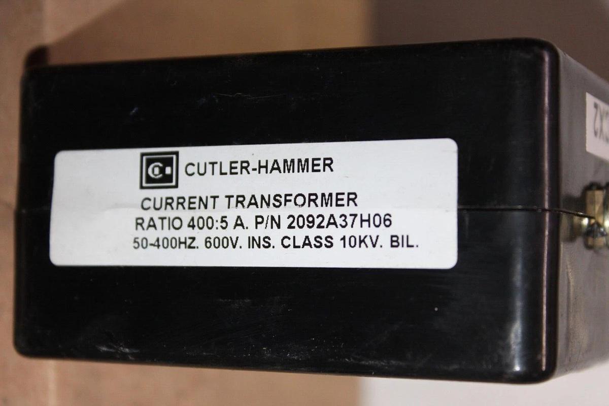 Used CUTLER HAMMER CURRENT TRANSFORMER 2092A37H06 3P81-401 400:5A 50-400 HZ