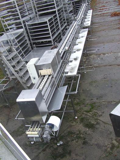 Used 24-position line (table) for manual product application in cans (containers)