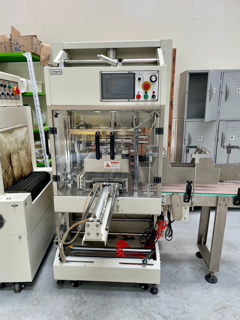 Usado MÁQUINA ENVOLVEDORA CON TÚNEL TERMOENCOGIBLE SEMIAUTOMÁTICA