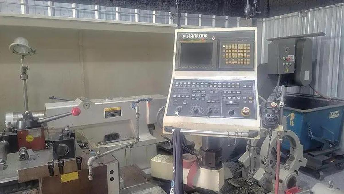Used 2006 HANKOOK Protec 9NC X 4000 WITH 10" Bar Capacity, 160" Centers, (2)- 25" Manual Chucks, FANUC 21iTB Run Time Hours 6,069