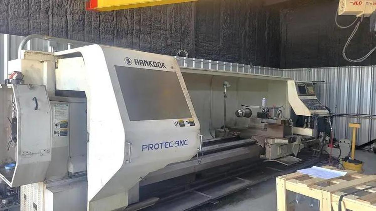 Used 2006 HANKOOK Protec 9NC X 4000 WITH 10" Bar Capacity, 160" Centers, (2)- 25" Manual Chucks, FANUC 21iTB Run Time Hours 6,069