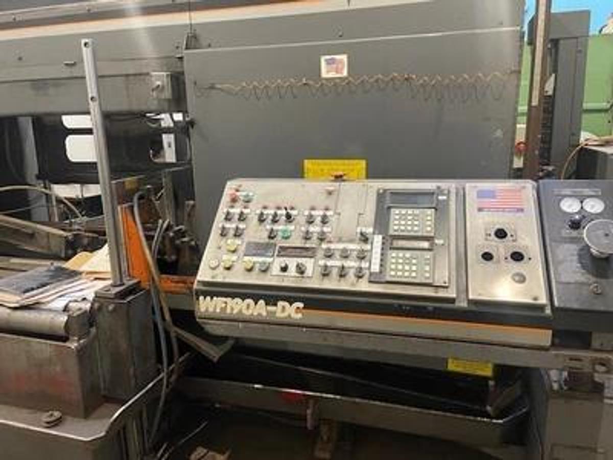 Used HEM saw Model WF 190A-DC Capacity 25" x 44" Automatic, Dual Column, , 24" Roller Discharge, Optional Top Clamp, Bi-Directional Outboard Powered Vise on Feed Table