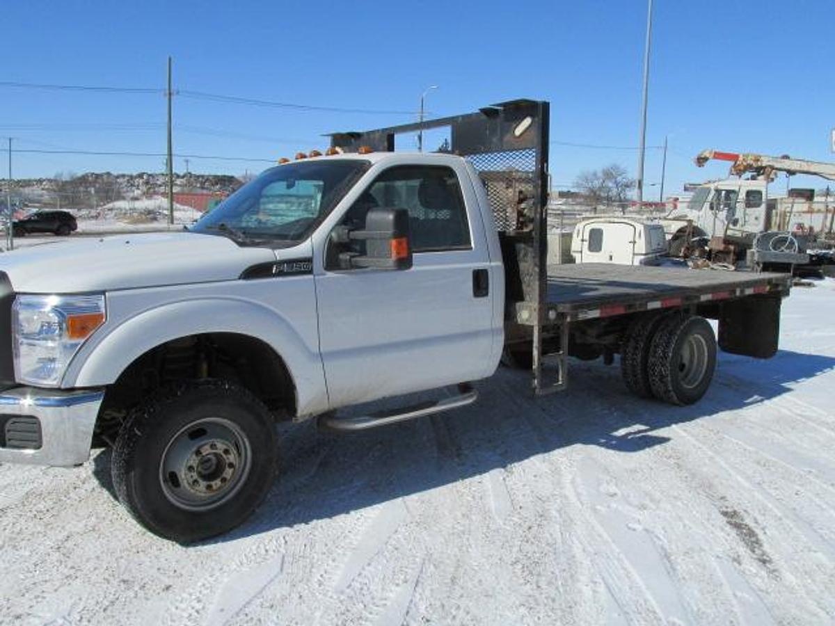 Used 2016 Ford F350 Regular Cab 4x4 with flat deck