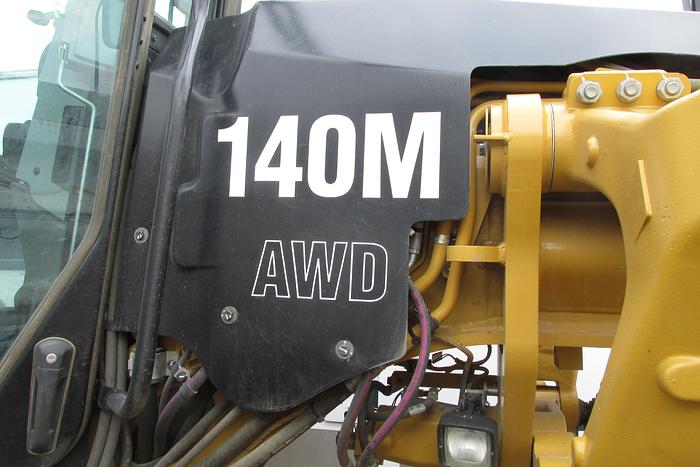 Used 2017 Caterpillar 140 M AWD with Snow wing, front lift group and rear ripper