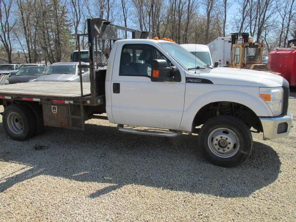 Used 2016 Ford F350 Regular Cab 4x4 with flat deck