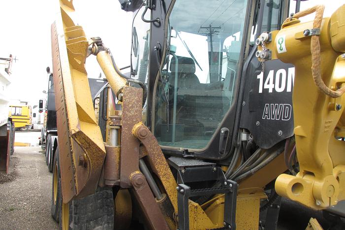 Used 2017 Caterpillar 140 M AWD with Snow wing, front lift group and rear ripper