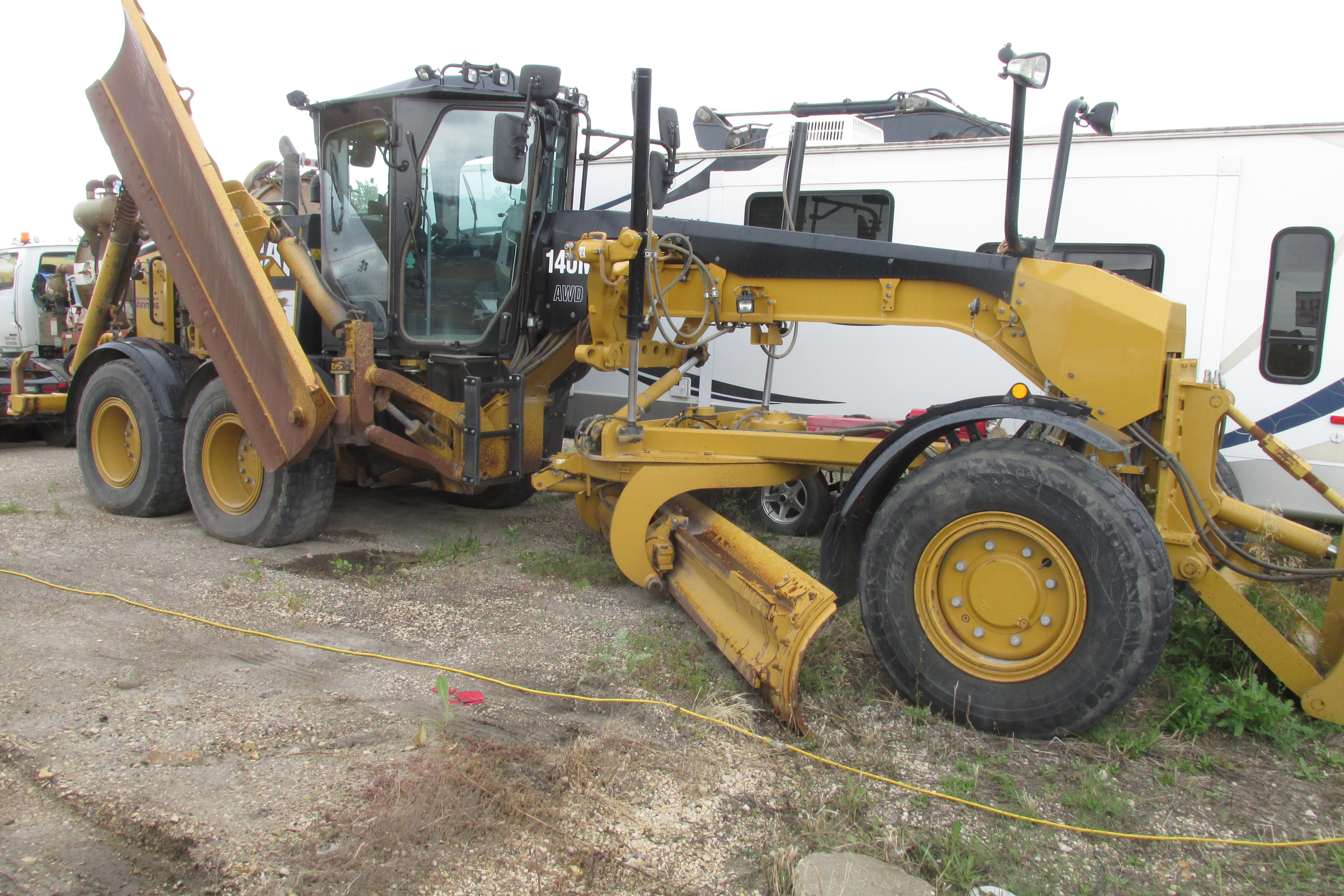 Used 2017 Caterpillar 140 M AWD with Snow wing, front lift group and rear ripper