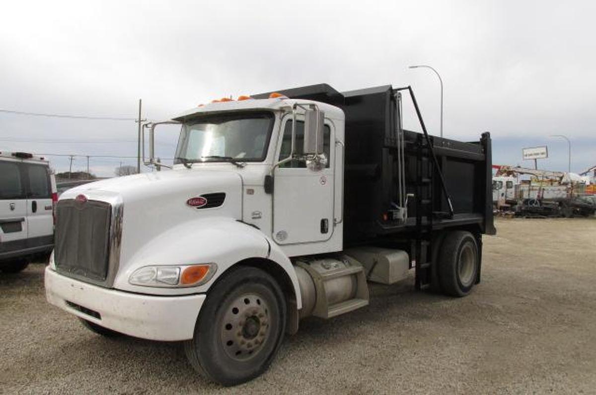 Used 2015 Peterbilt 337 with a new 12 ft Hardox dump box hydraulic brakes