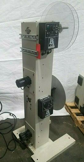 Used PA Industries Double Coil Motorized Stock Reel with Paper Interleaf Payoff Feed