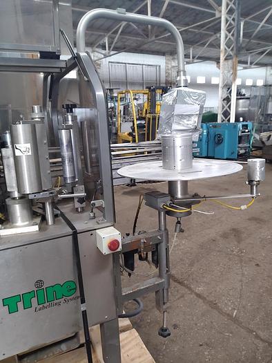 Used TRine 4500 roll fed labeler - hot melt