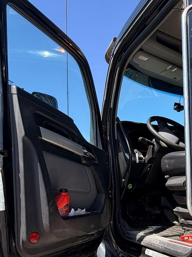 Used 2023 Kenworth T880 tri-axle dump truck, 123,870 miles