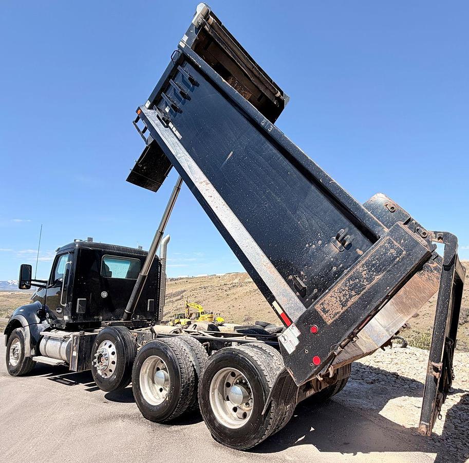Used 2023 Kenworth T880 tri-axle dump truck, 123,870 miles
