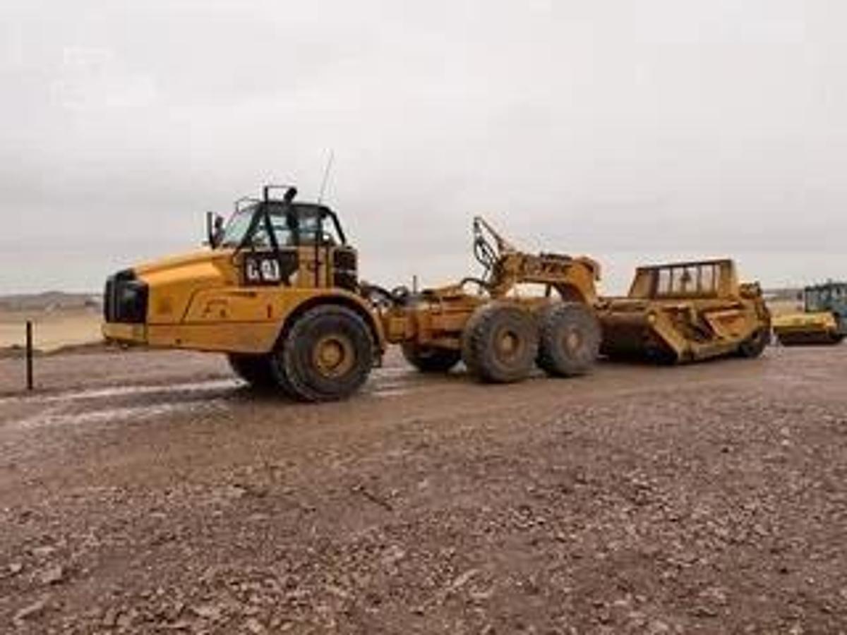Used Caterpillar 740B, articulated dump truck with KTec Scraper