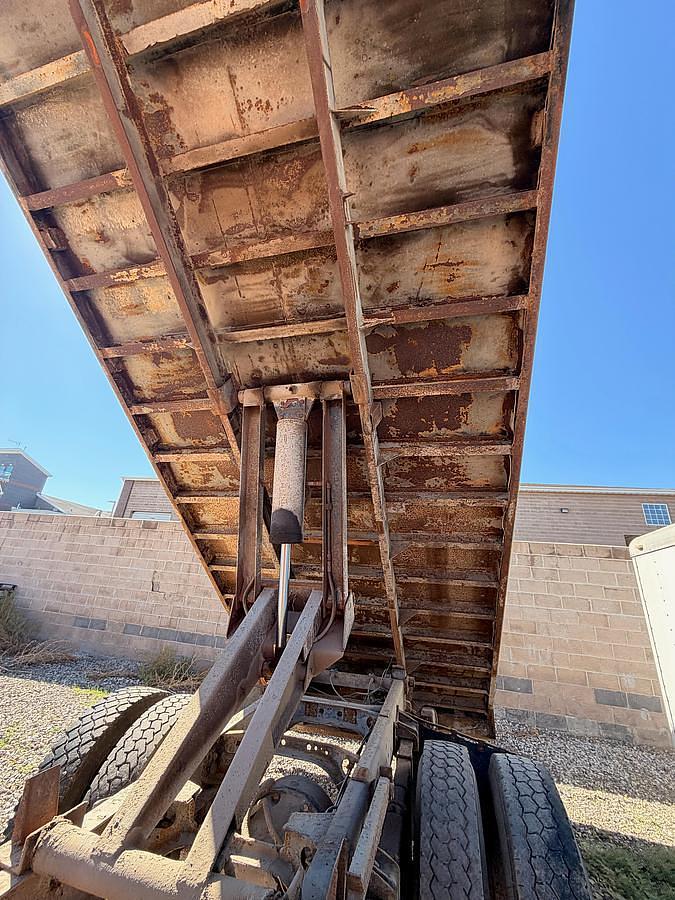 Used 1990 International 8300 Eagle Flatbed Dump Truck, Stake Body. flatbed