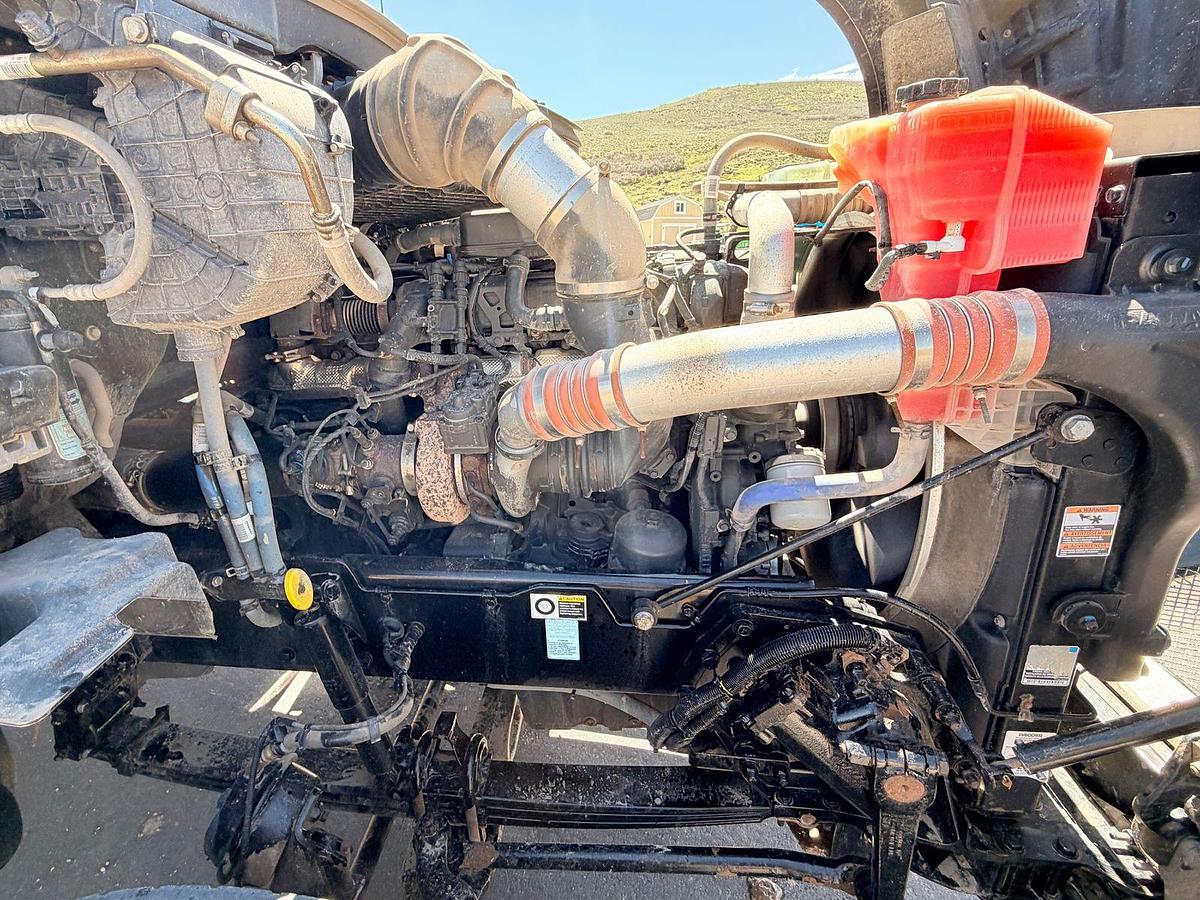Used 2023 Kenworth T880 tri-axle dump truck, 123,870 miles