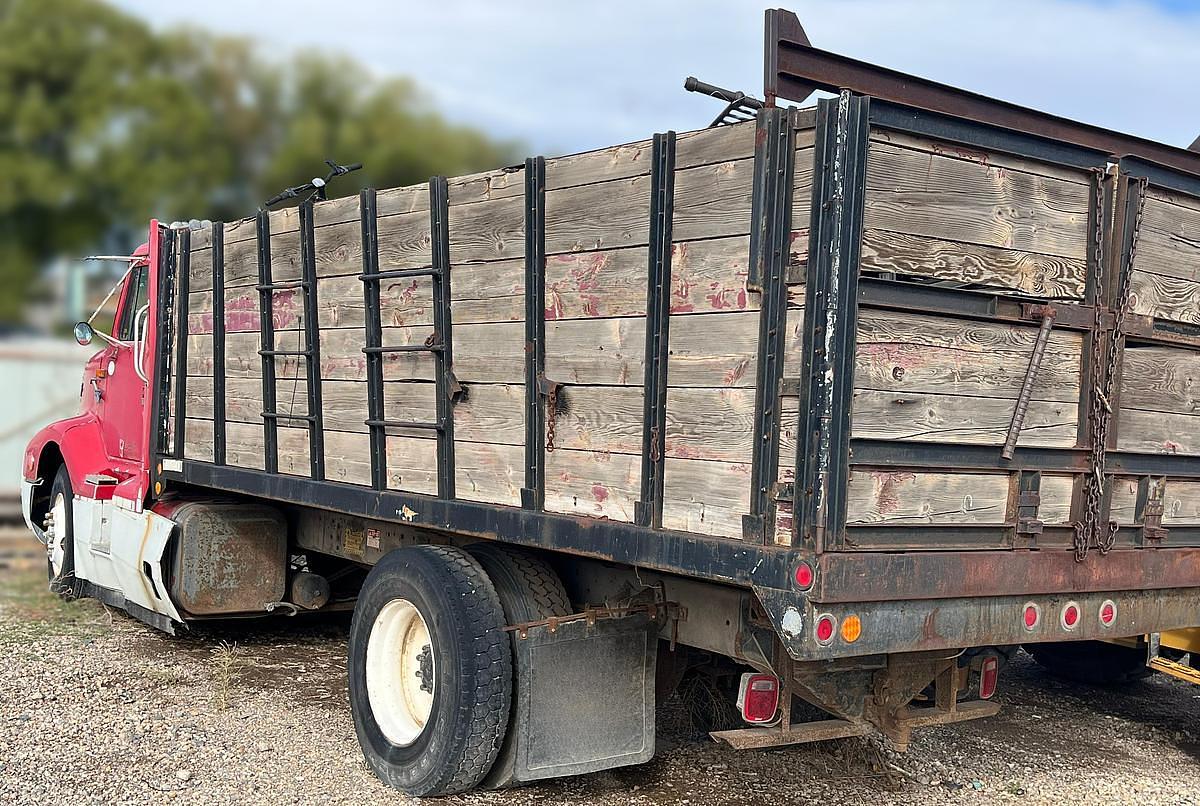 Used 1990 International 8300 Eagle Flatbed Dump Truck, Stake Body. flatbed