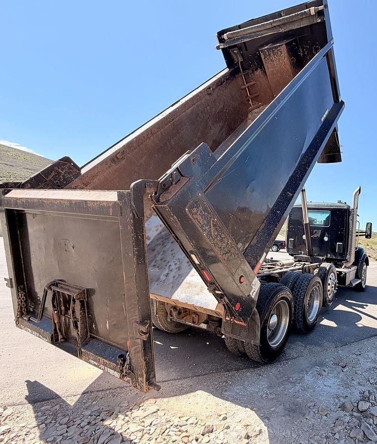 Used 2023 Kenworth T880 tri-axle dump truck, 123,870 miles