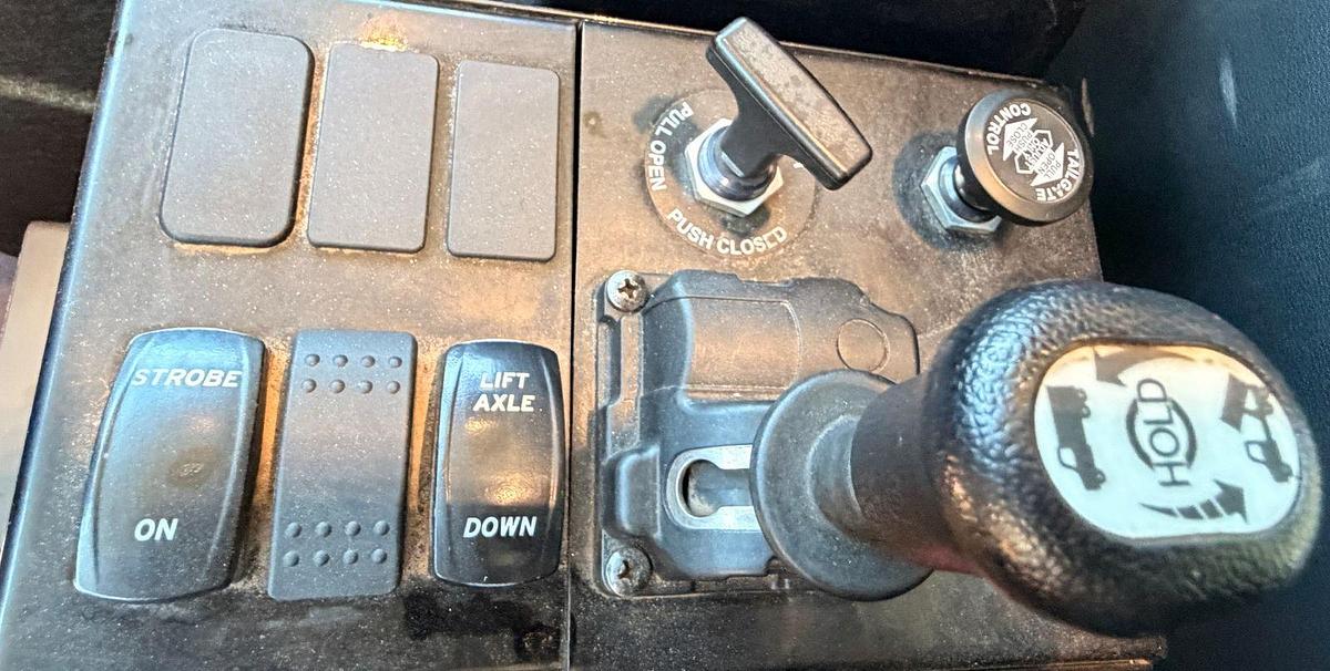 Used 2023 Kenworth T880 tri-axle dump truck, 123,870 miles