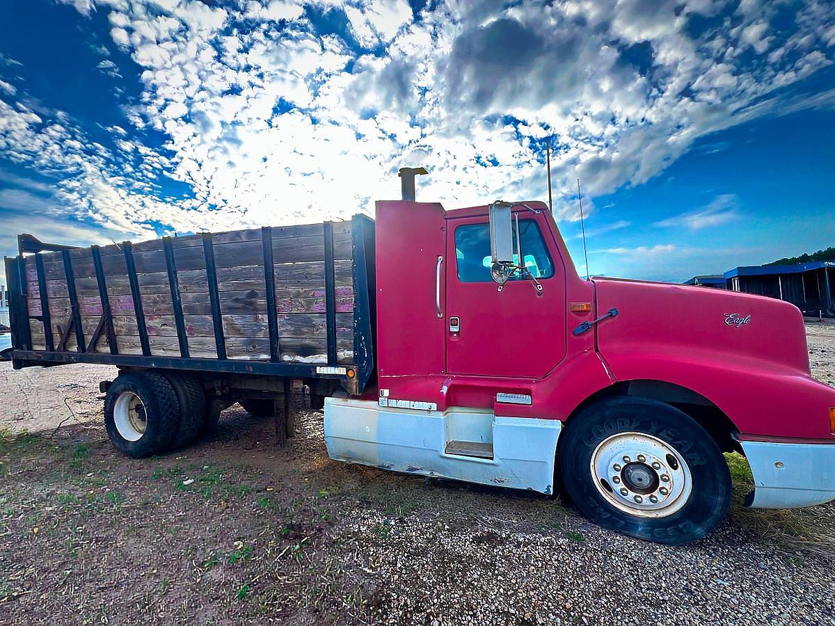 Used 1990 International 8300 Eagle Flatbed Dump Truck, Stake Body. flatbed
