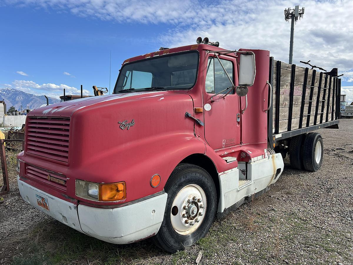 Used 1990 International 8300 Eagle Flatbed Dump Truck, Stake Body. flatbed