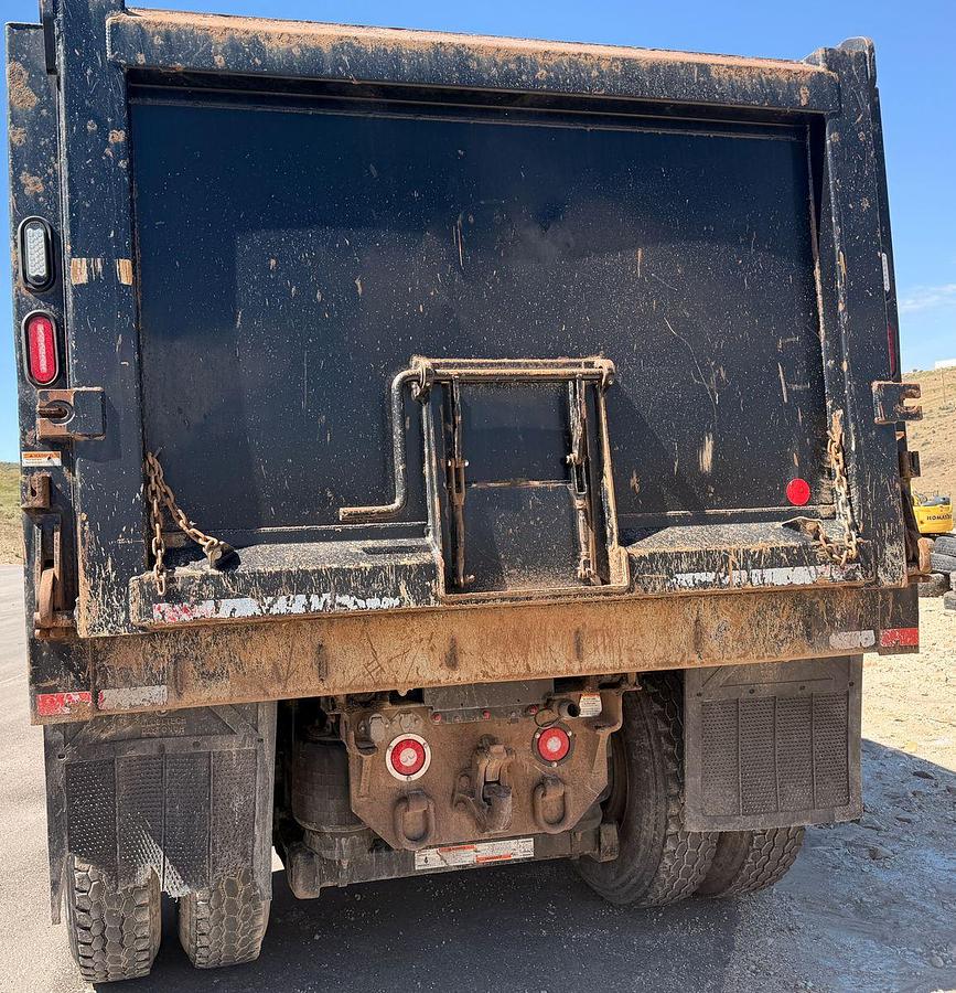 Used 2023 Kenworth T880 tri-axle dump truck, 123,870 miles