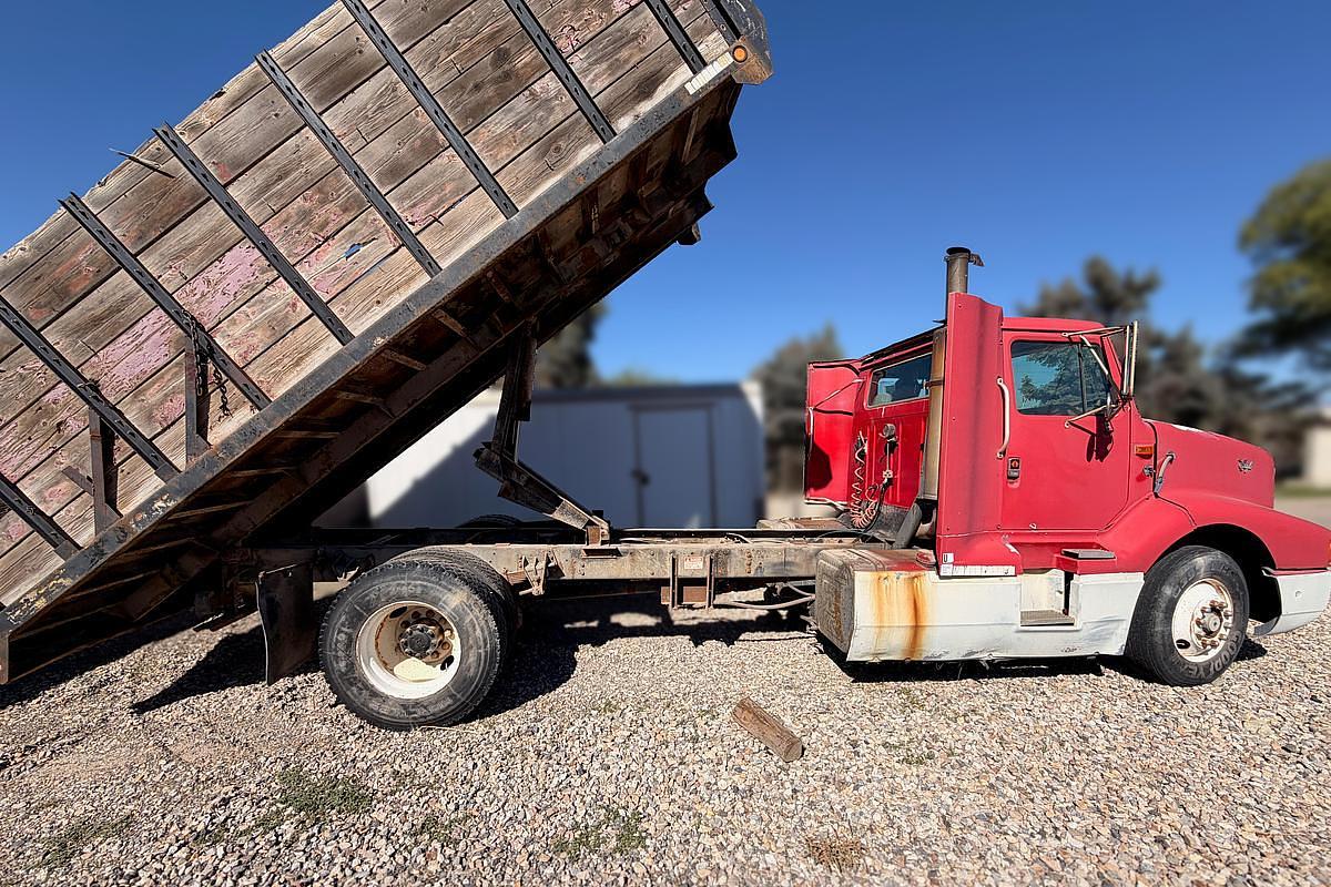 Used 1990 International 8300 Eagle Flatbed Dump Truck, Stake Body. flatbed